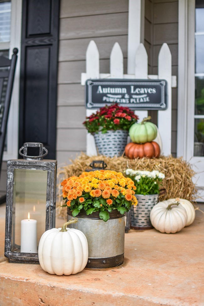 Farmhouse fall front porch with lots of mums, hay and pumpkins-3 Farmhouse fall front porch with lots of mums, hay and pumpkins-3